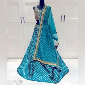Teal lengha, with net dupatta, gotta patti handwork.